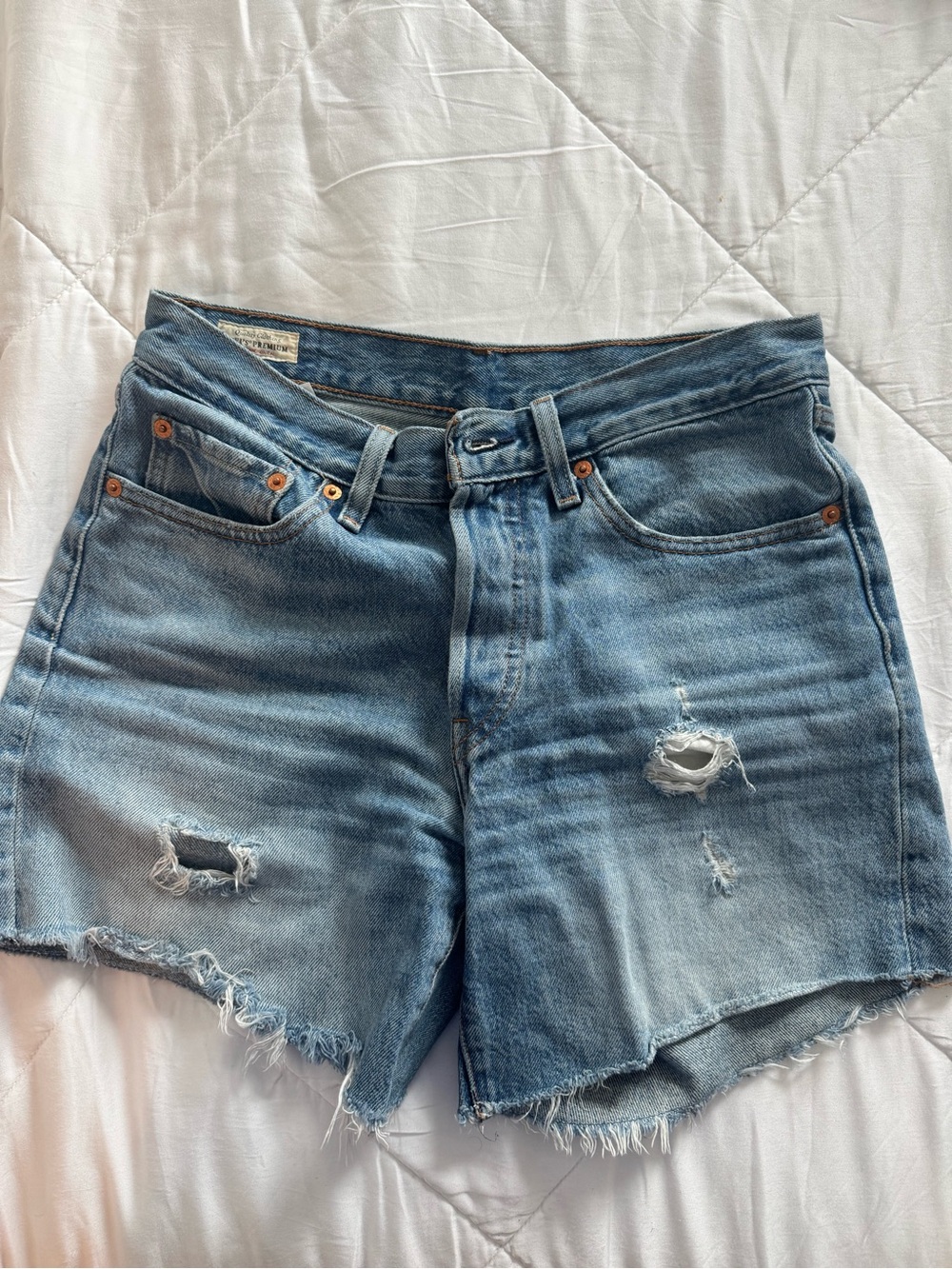 Levi’s Washed Blue Distressed Denim Shorts